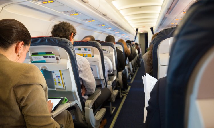 passenger-rested-feet-back-of-front-seat
