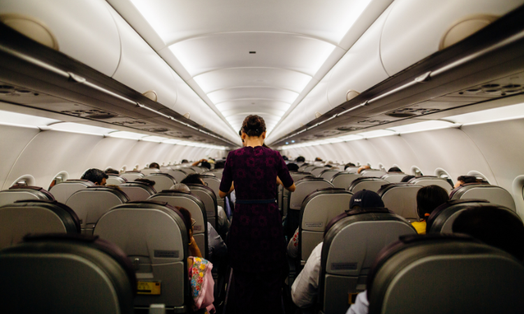passenger-rested-feet-back-of-front-seat-